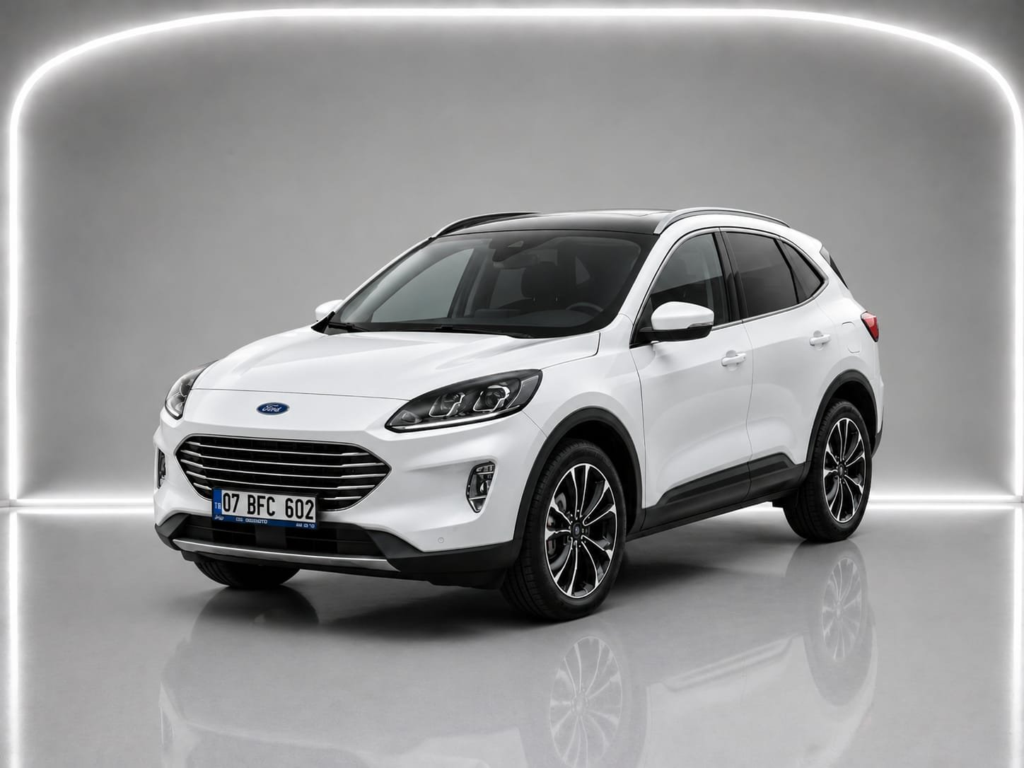 White 2023 Ford Kuga shown from the front three-quarter angle in a studio setting.