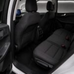 Rear seats and interior of a 2023 Ford Kuga with the rear door open